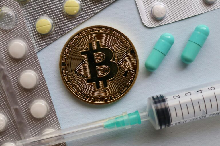 Bitcoin and Pills on Table